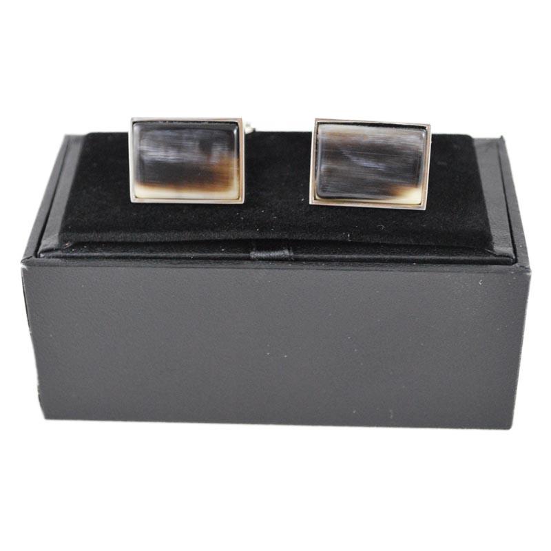 A pair of black rectangular oxhorn cufflinks with a rhodium finish and a swivel barrel design.