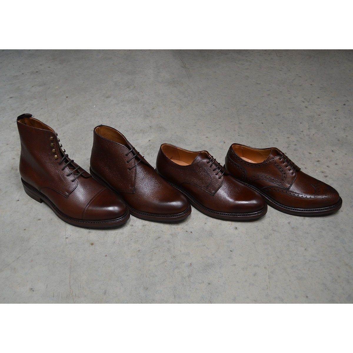 A Berwick 1707 brown brogue derby shoe & others styles with a round toe shape and lace-up closure. It features a grainy texture and brogue detailing & Dainite soles