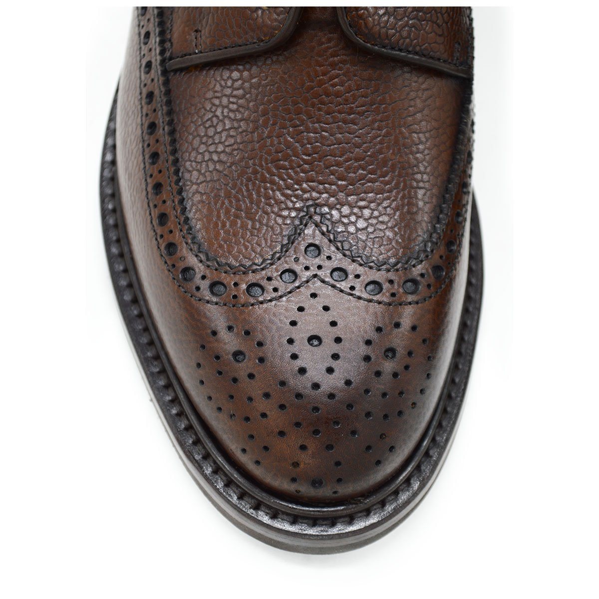 A Berwick 1707 brown brogue derby shoe with a round toe shape and lace-up closure. It features a grainy texture and brogue detailing & Dainite soles