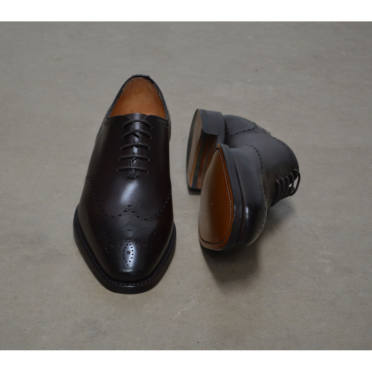 A Berwick 1707 moka brown wholecut Oxford brogue shoe with a goodyear welted leather sole, last week, and a smooth finish.