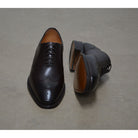 A Berwick 1707 moka brown wholecut Oxford brogue shoe with a goodyear welted leather sole, last week, and a smooth finish.