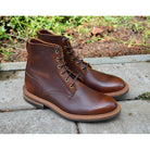 A brown leather service boot with a dainite sole and brass eyelets, designed for the forestry industry.