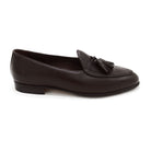 A Berwick 1707 dark brown deerskin Belgian loafer with a tassel detail on the vamp, displayed on a white background.