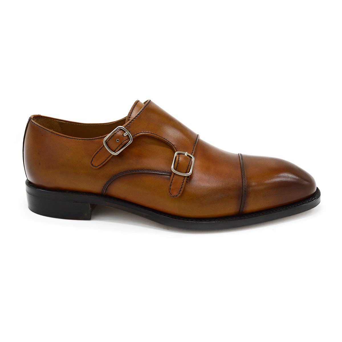 A brown double monk strap shoe with a polished leather upper and a Goodyear welted sole.
