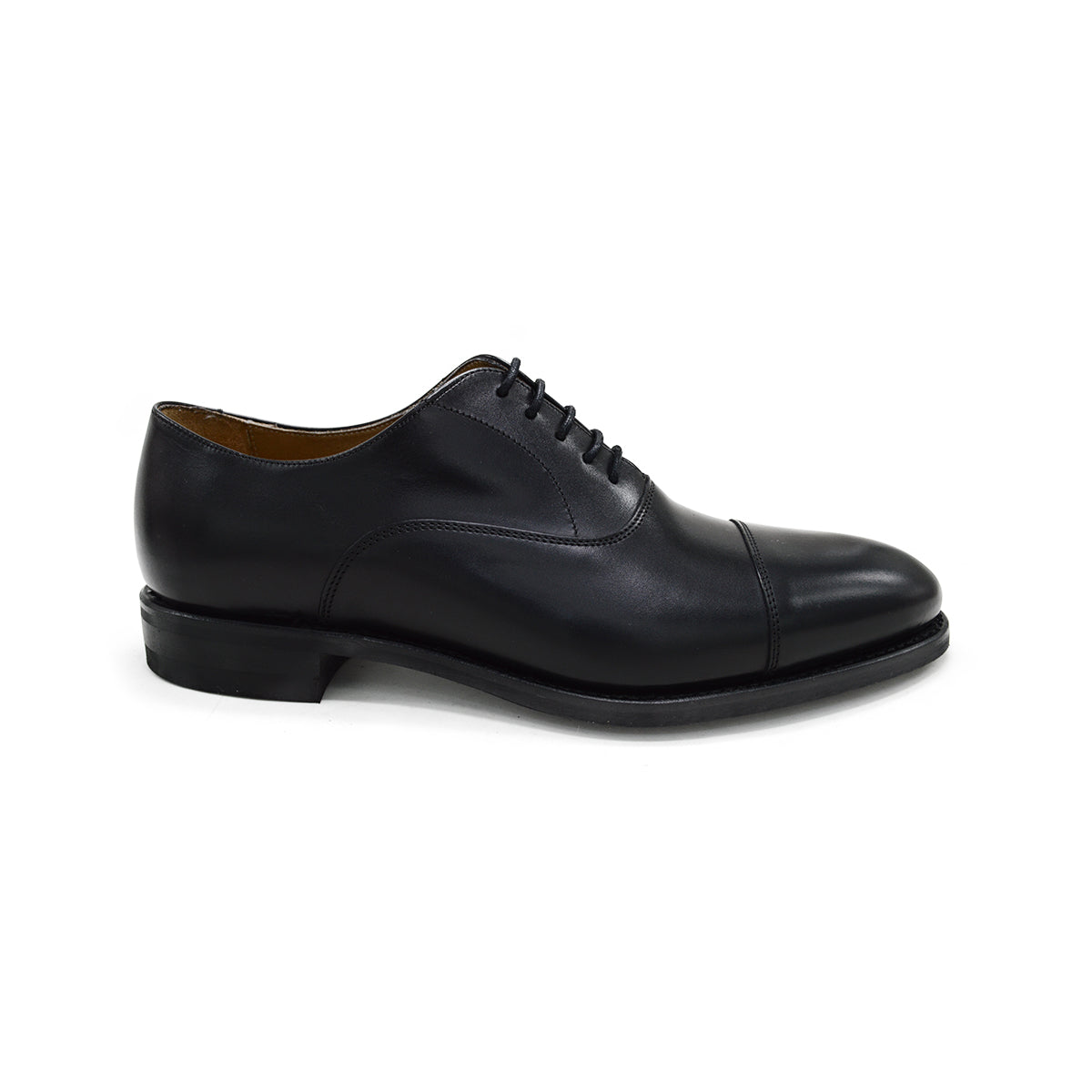 A Berwick 1707 black Oxford shoe with a polished, smooth upper and a Dainite rubber sole.