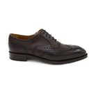 A dark brown Oxford brogue shoe with intricate brogue detailing and a goodyear welted leather sole.