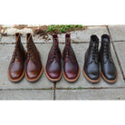 A brown leather service boot with a dainite sole and brass eyelets, designed for the forestry industry.