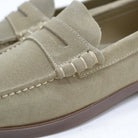 Close-up of a sand loafer shoe on a white background