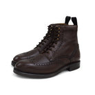 A Berwick 1707 dark brown brogue boot with a lace-up closure, round toe shape, and a Dainite rubber sole.