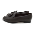 A Berwick 1707 dark brown deerskin Belgian loafer with a tassel detail on the vamp, displayed on a white background.