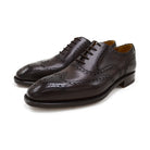 A dark brown Oxford brogue shoe with intricate brogue detailing and a goodyear welted leather sole.