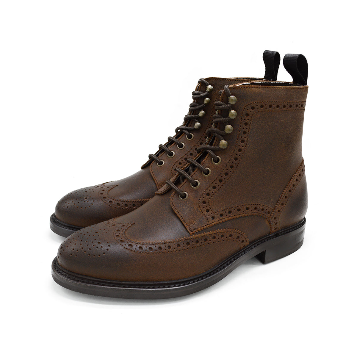 A dark brown lace-up brogue boot with a rubber sole and visible stitching on the upper part.