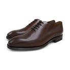A Berwick 1707 brown leather wholecut oxford shoe with a lace-up closure and a round toe.