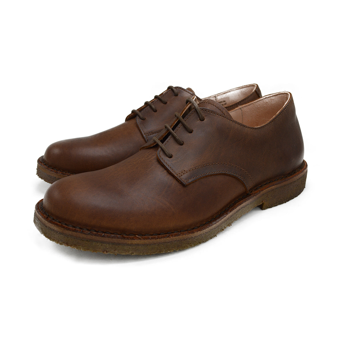 A dark chestnut brown Astorflex Redflex derby shoe made of nubuck leather, featuring a natural crepe rubber sole.