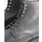 A Berwick 1707 black grain toe cap boot with a full lace-up construction and a round toe shape, set against a white background.