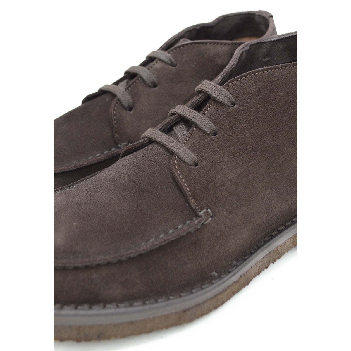 A brown Berwick 1707 apron boot with lace-up closure, handcrafted from reverse kudu suede, featuring moccasin stitching and a crepe rubber sole.