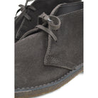 A brown Astorflex Montflex unlined boot with a lace-up closure, made from reverse suede, showcasing the natural rubber sole.