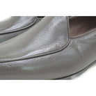 A dark brown deerskin leather Belgian loafer with an almond toe shape and minimal stitching.
