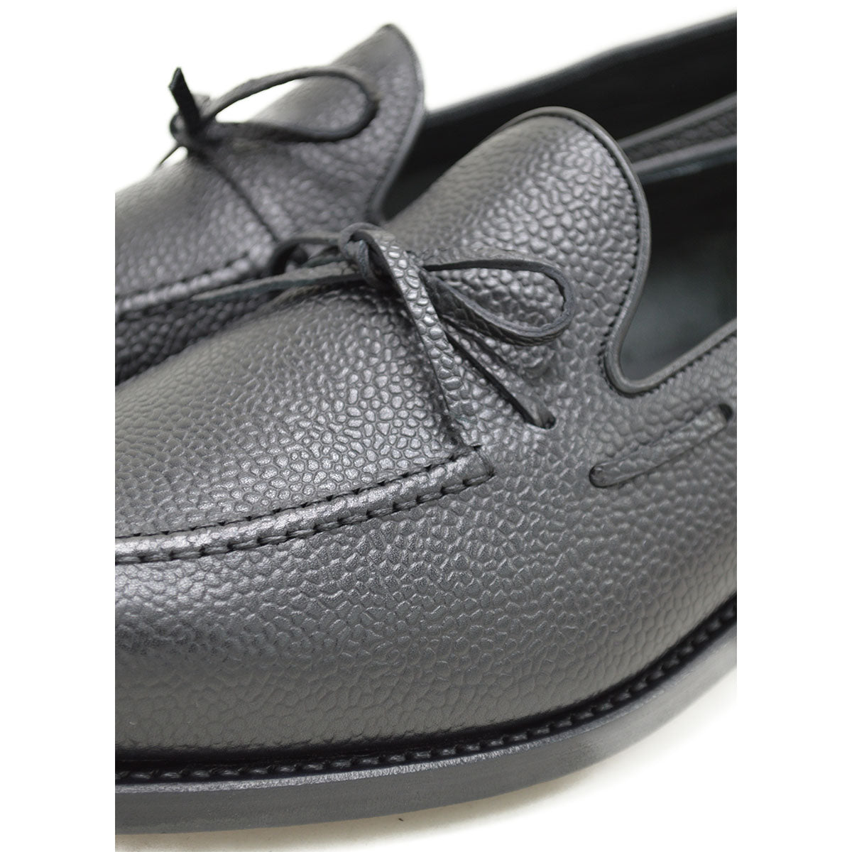 A Berwick 1707 classic black unlined laced slip-on loafer with a Goodyear welted leather sole.