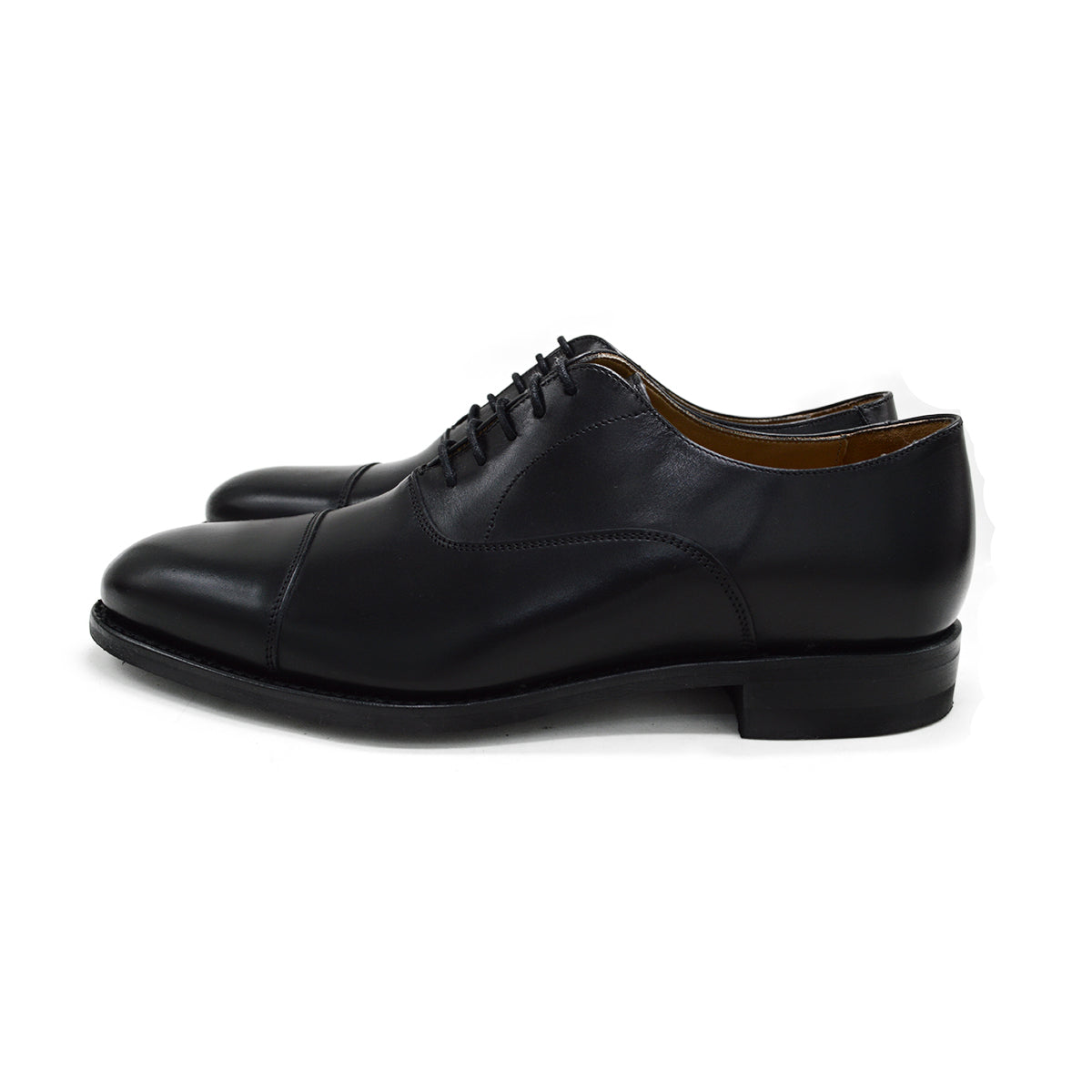 A Berwick 1707 black Oxford shoe with a polished, smooth upper and a Dainite rubber sole.