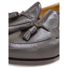 A Berwick 1707 dark brown deerskin slip-on loafer with a tassel detail on the vamp & Dainite sole, displayed on a plain background