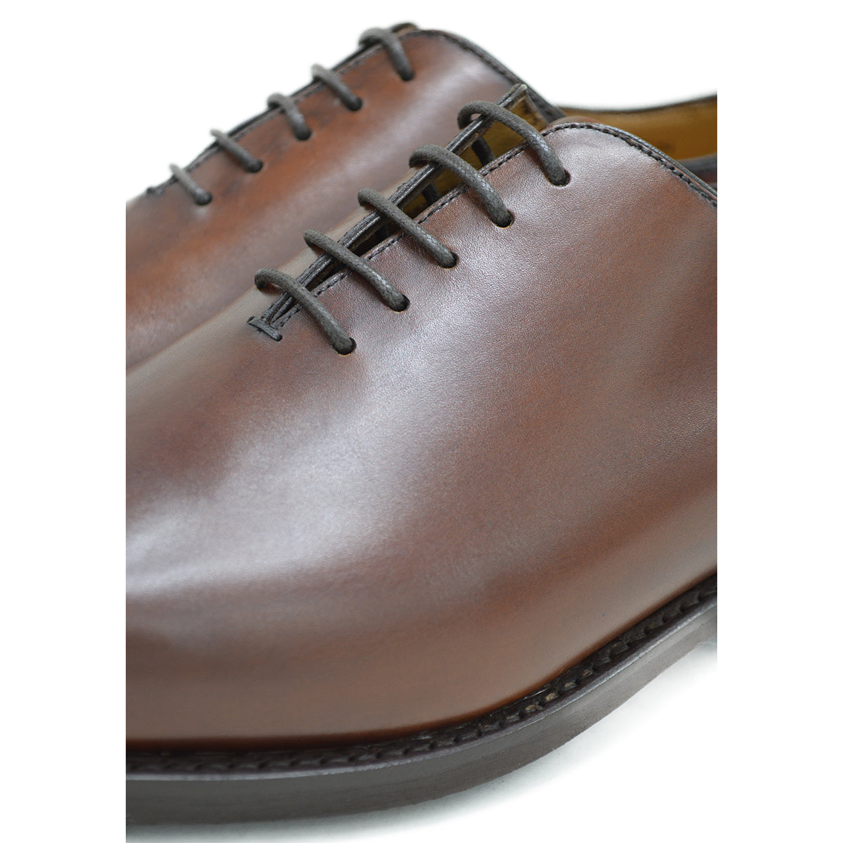 A Berwick 1707 brown leather wholecut oxford shoe with a lace-up closure and a round toe.