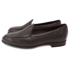 A dark brown deerskin leather Belgian loafer with an almond toe shape and minimal stitching.