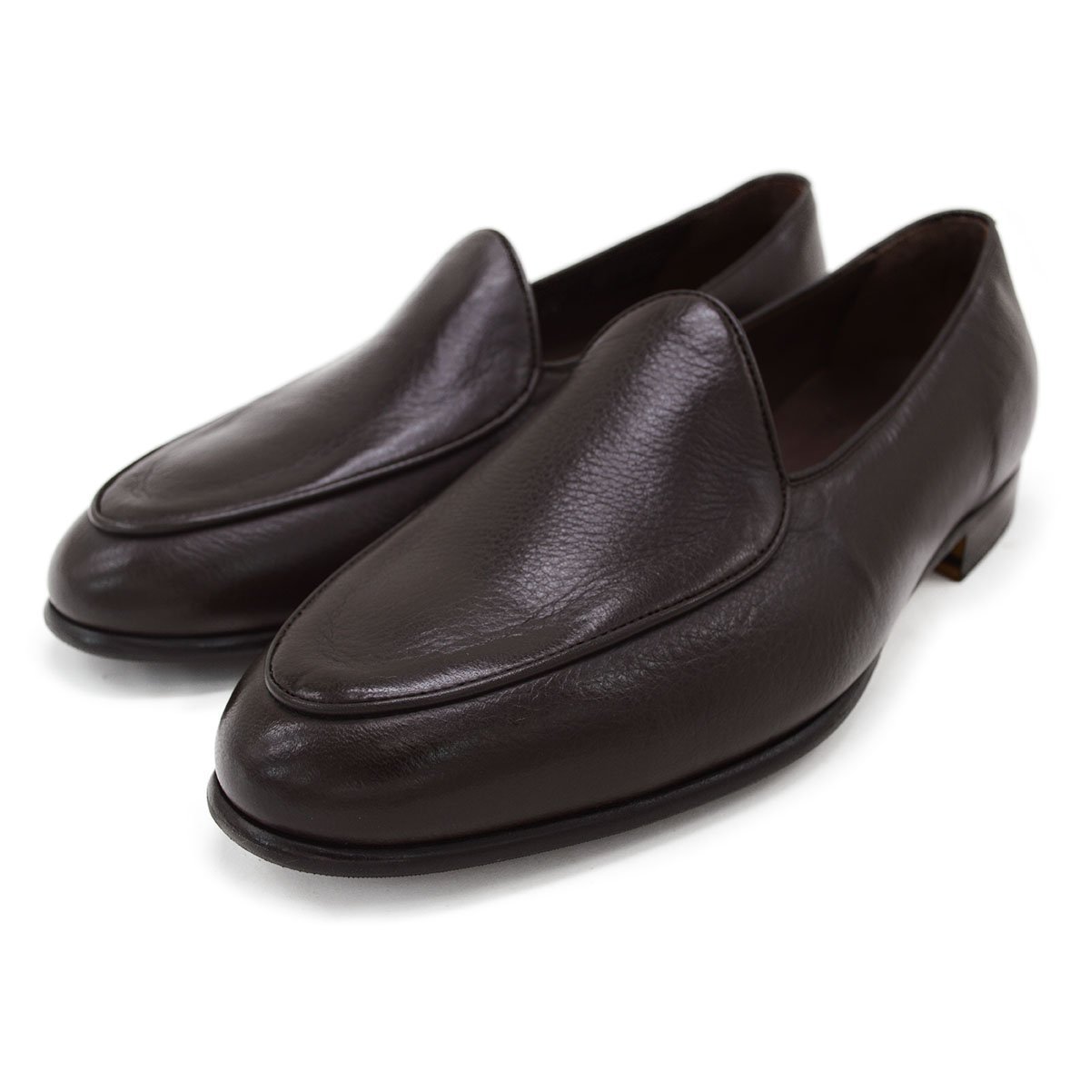 A dark brown deerskin leather Belgian loafer with an almond toe shape and minimal stitching.