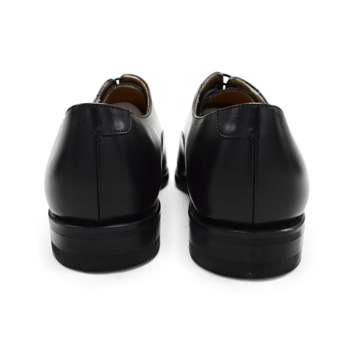A Berwick 1707 black Oxford shoe with a polished, smooth upper and a Dainite rubber sole.