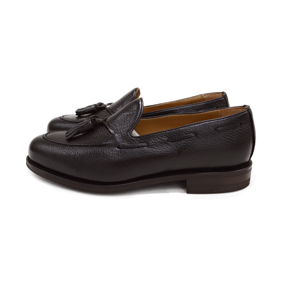 A Berwick 1707 dark brown deerskin slip-on loafer with a tassel detail on the vamp & Dainite sole, displayed on a plain background