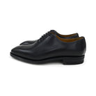 A black Berwick 1707 Wholecut Oxford shoe made from box calf leather with a lace-up closure and a round toe.