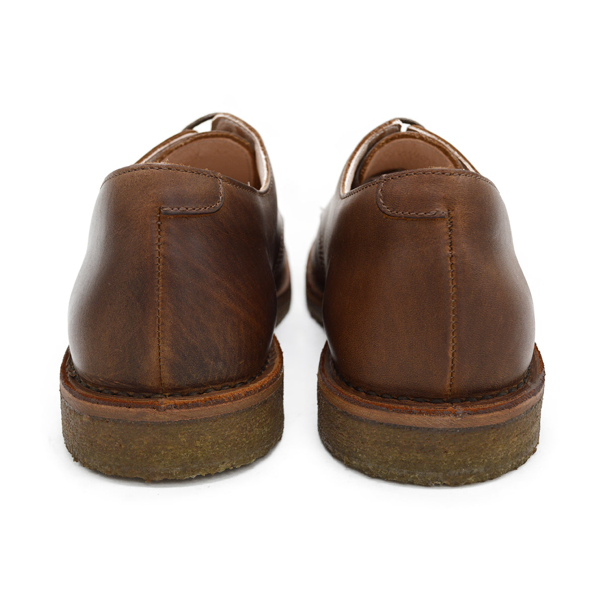 A dark chestnut brown Astorflex Redflex derby shoe made of nubuck leather, featuring a natural crepe rubber sole.