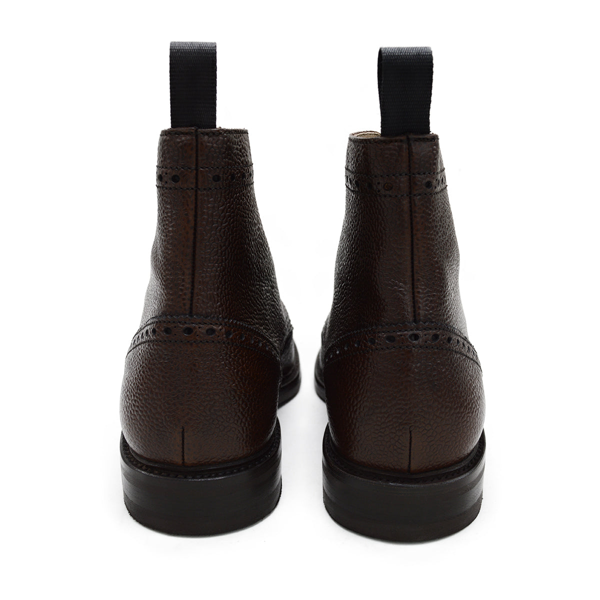 A Berwick 1707 dark brown brogue boot with a lace-up closure, round toe shape, and a Dainite rubber sole.