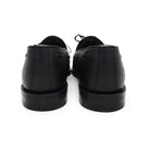 A Berwick 1707 classic black unlined laced slip-on loafer with a Goodyear welted leather sole.
