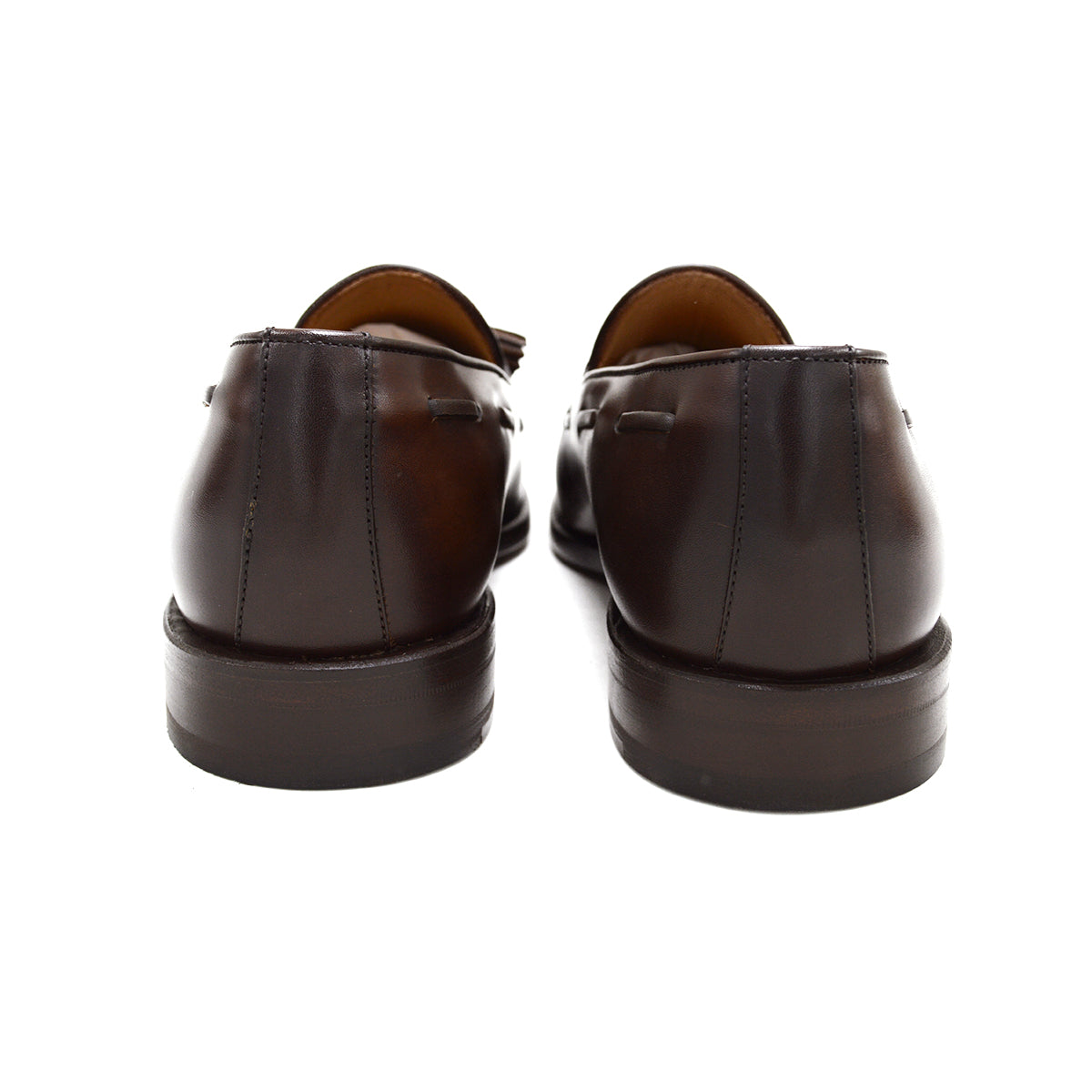 A Berwick 1707 brown tasseled loafer shoe with a closed toe and leather sole.
