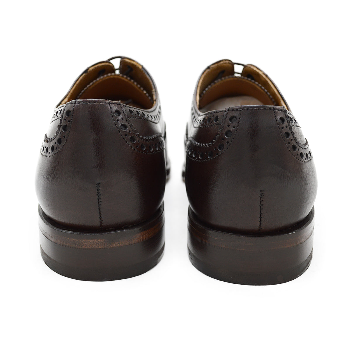 A dark brown Oxford brogue shoe with intricate brogue detailing and a goodyear welted leather sole.