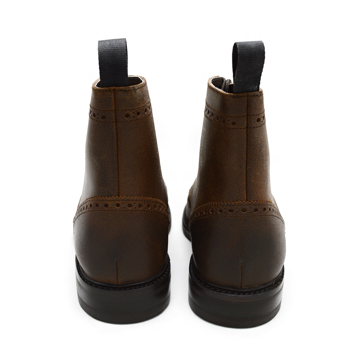 A dark brown lace-up brogue boot with a rubber sole and visible stitching on the upper part.