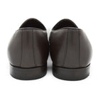 A Berwick 1707 dark brown deerskin Belgian loafer with a tassel detail on the vamp, displayed on a white background.