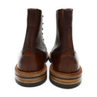 A brown leather service boot with a dainite sole and brass eyelets, designed for the forestry industry.