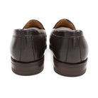 A dark brown deerskin penny loafer with a velvety soft texture and a classic round toe shape on a white background with Dainite Studded Rubber Sole.