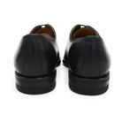 A black Berwick 1707 Wholecut Oxford shoe made from box calf leather with a lace-up closure and a round toe.