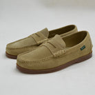 Pair of sand loafers on a white background