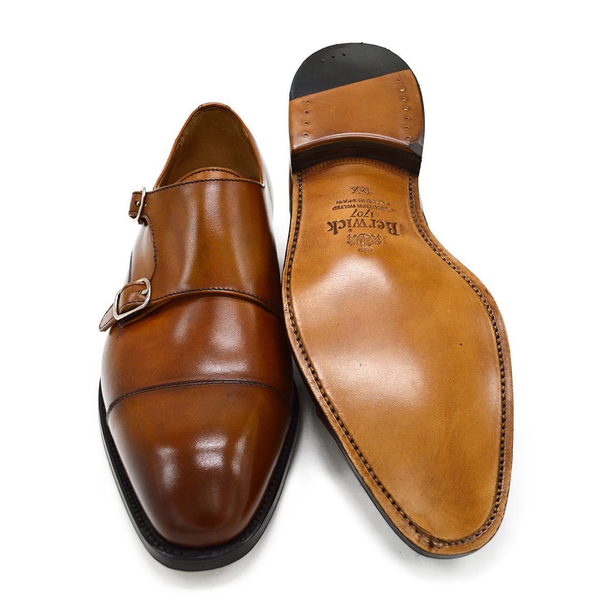 A brown double monk strap shoe with a polished leather upper and a Goodyear welted sole.