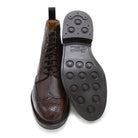 A Berwick 1707 dark brown brogue boot with a lace-up closure, round toe shape, and a Dainite rubber sole.