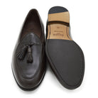 A Berwick 1707 dark brown deerskin Belgian loafer with a tassel detail on the vamp, displayed on a white background.