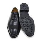A black Berwick 1707 Wholecut Oxford shoe made from box calf leather with a lace-up closure and a round toe.