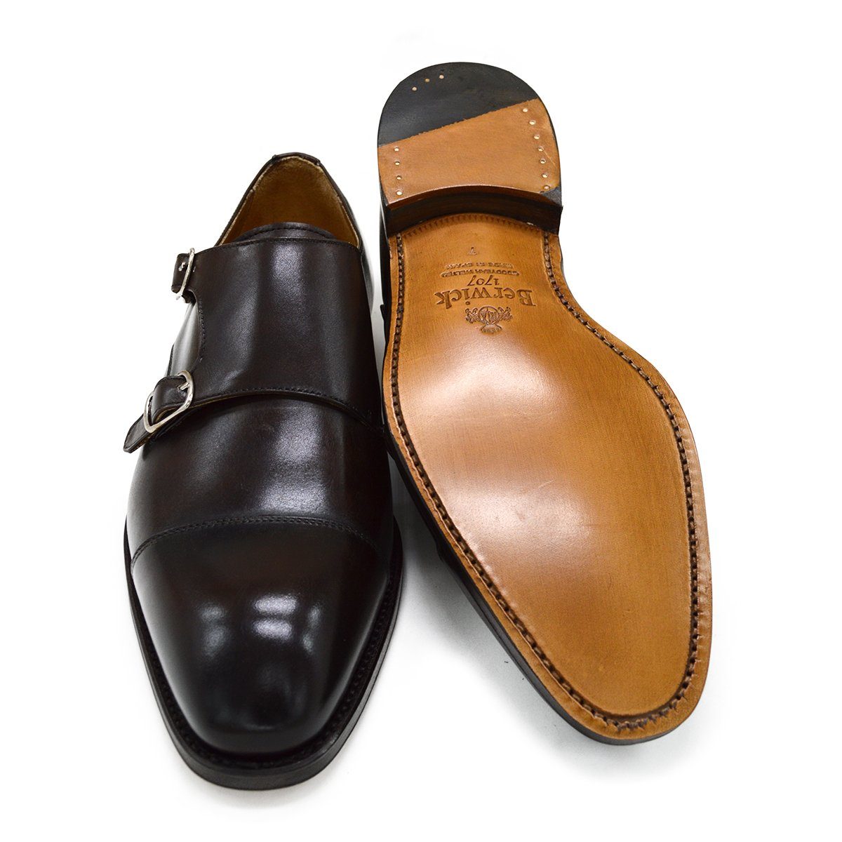 A Berwick 1707 lack double monk shoe with two buckle straps, made from calf leather and featuring a Goodyear welted leather sole.