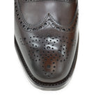 A dark brown Oxford brogue shoe with intricate brogue detailing and a goodyear welted leather sole.