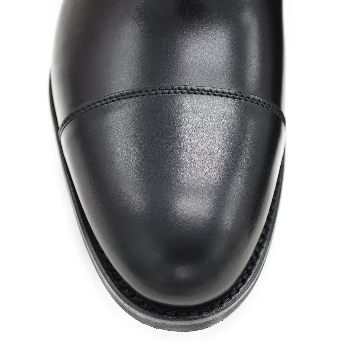 A Berwick 1707 black Oxford shoe with a polished, smooth upper and a Dainite rubber sole.