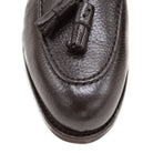 A Berwick 1707 dark brown deerskin slip-on loafer with a tassel detail on the vamp & Dainite sole, displayed on a plain background